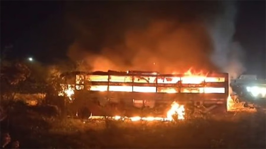 Bus rams truck, catches fire